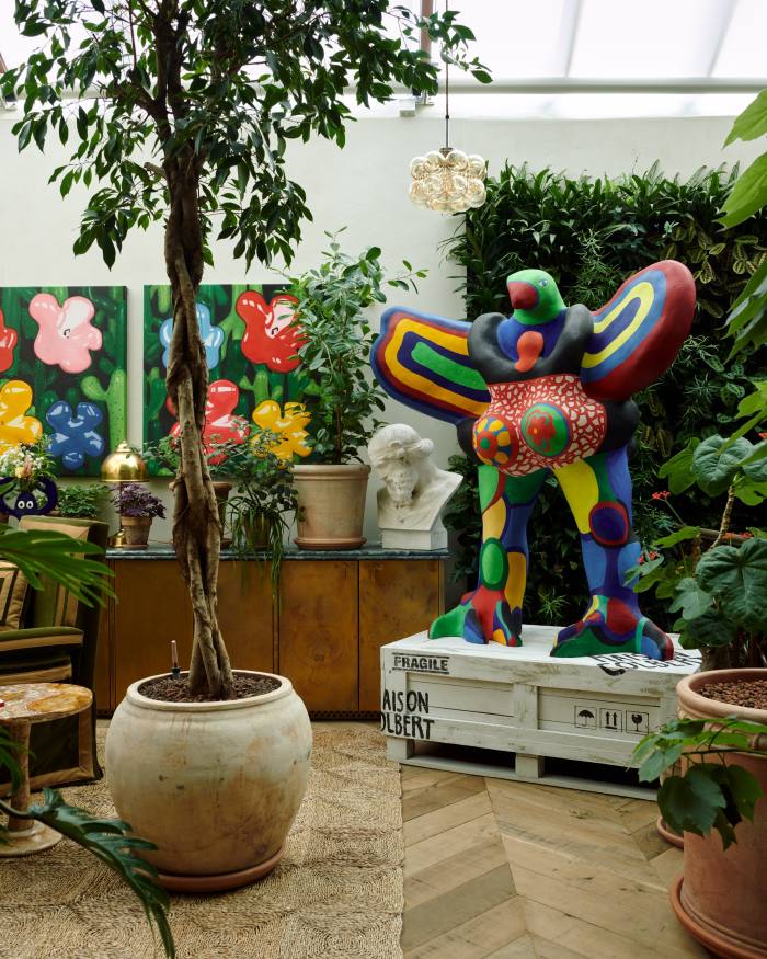 L’oiseau amoureux sculpture by Niki de Saint Phalle in the games room, with Flower Studies From The Lobster Land Museum, 2021, by Philip Colbert on the wall