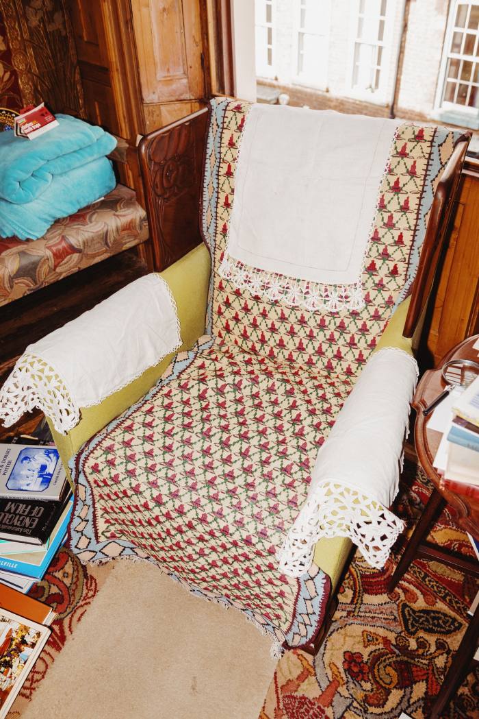 One of a pair of chairs in their home