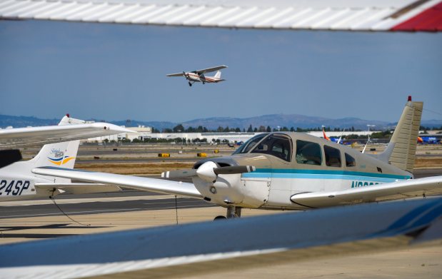 A small aircraft takes off at Long Beach Airport in...