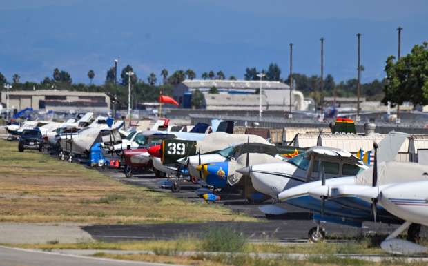 Aircraft sit at Long Beach Airport in Long Beach, CA,...