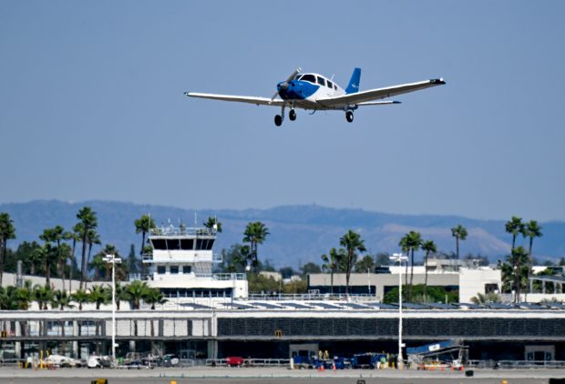 A small plane takes off from Long Beach Airport in...